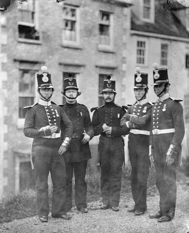 Men of the Royal Marines and Rifle Brigade who received the Crimean Medal from Queen Victoria on 18 May 1855. This is the oldest true photograph in the timeline. Everything above it is a painting, drawing or print.