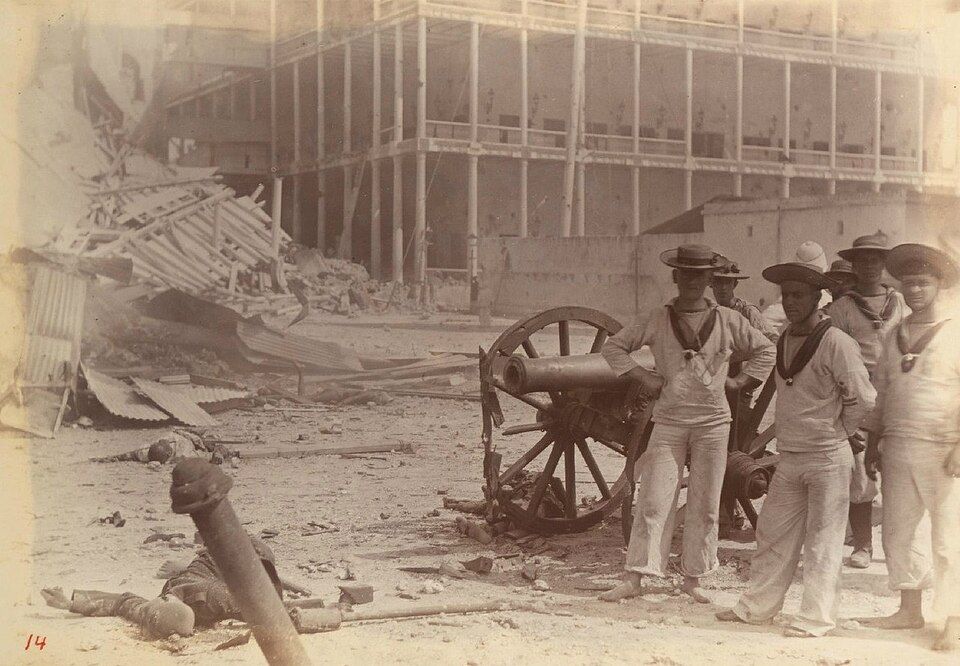 British marines pose with a captured Zanzibari gun after the capture of the Sultan's palace in Zanzibar Town.
