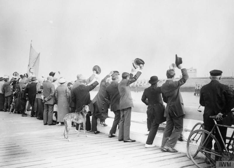 Belgian civilians cheer British marines arriving at Ostend. That year Royal Marines, as part of the Royal Naval Division, landed in Belgium to help defend Antwerp.