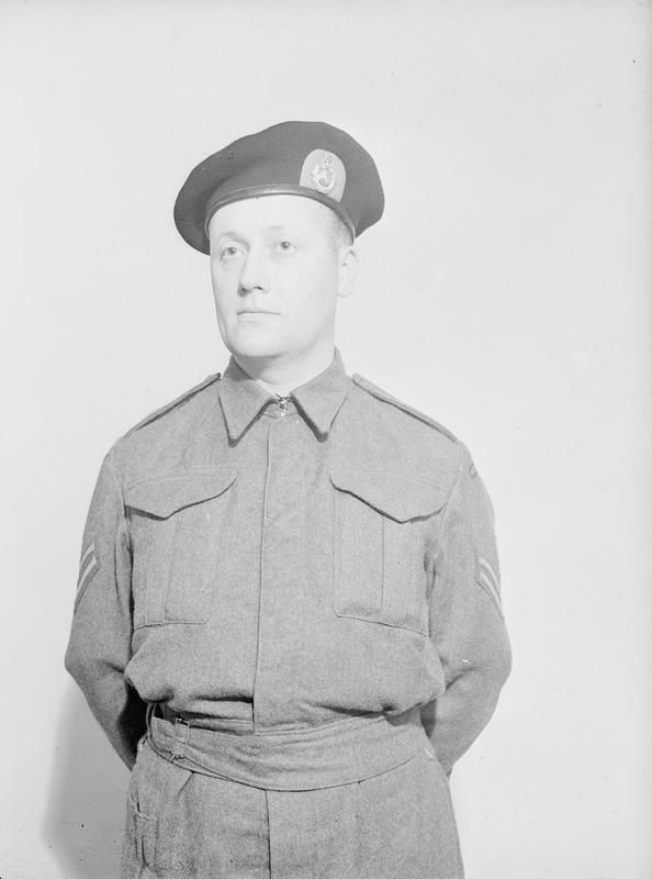 A navy-blue beret with a scarlet patch behind the Globe and Laurel badge, adopted as the Royal Marines' new headdress. The first RM commando unit had been formed at Deal on 14 February 1942.