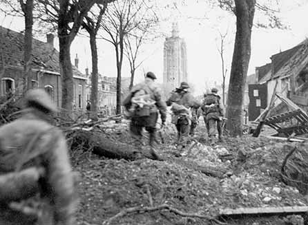 No. 41 (Royal Marine) Commando advance on the Westkapelle lighthouse. 4 Commando Brigade, all Royal Marines after March 1944, fought on Walcheren during the clearing of Antwerp.